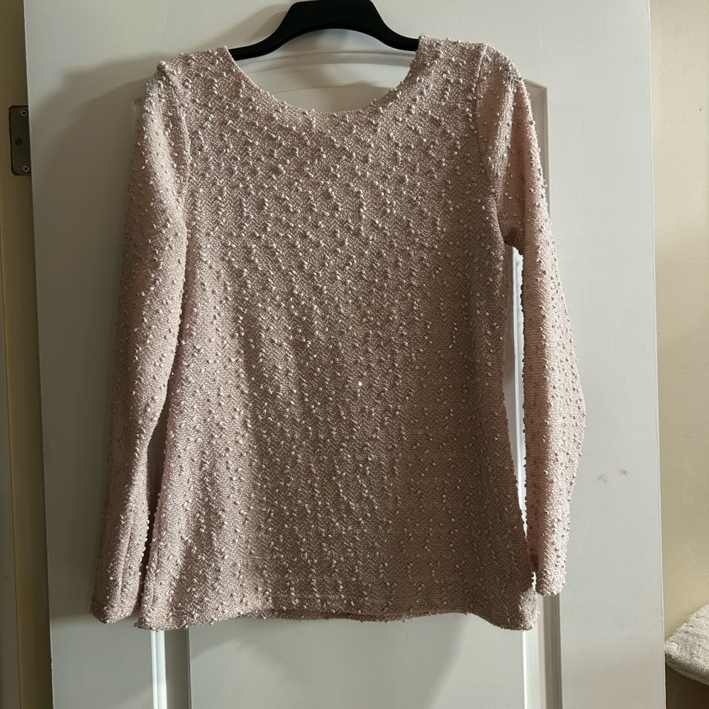 Pink Jennifer Lopez sweater